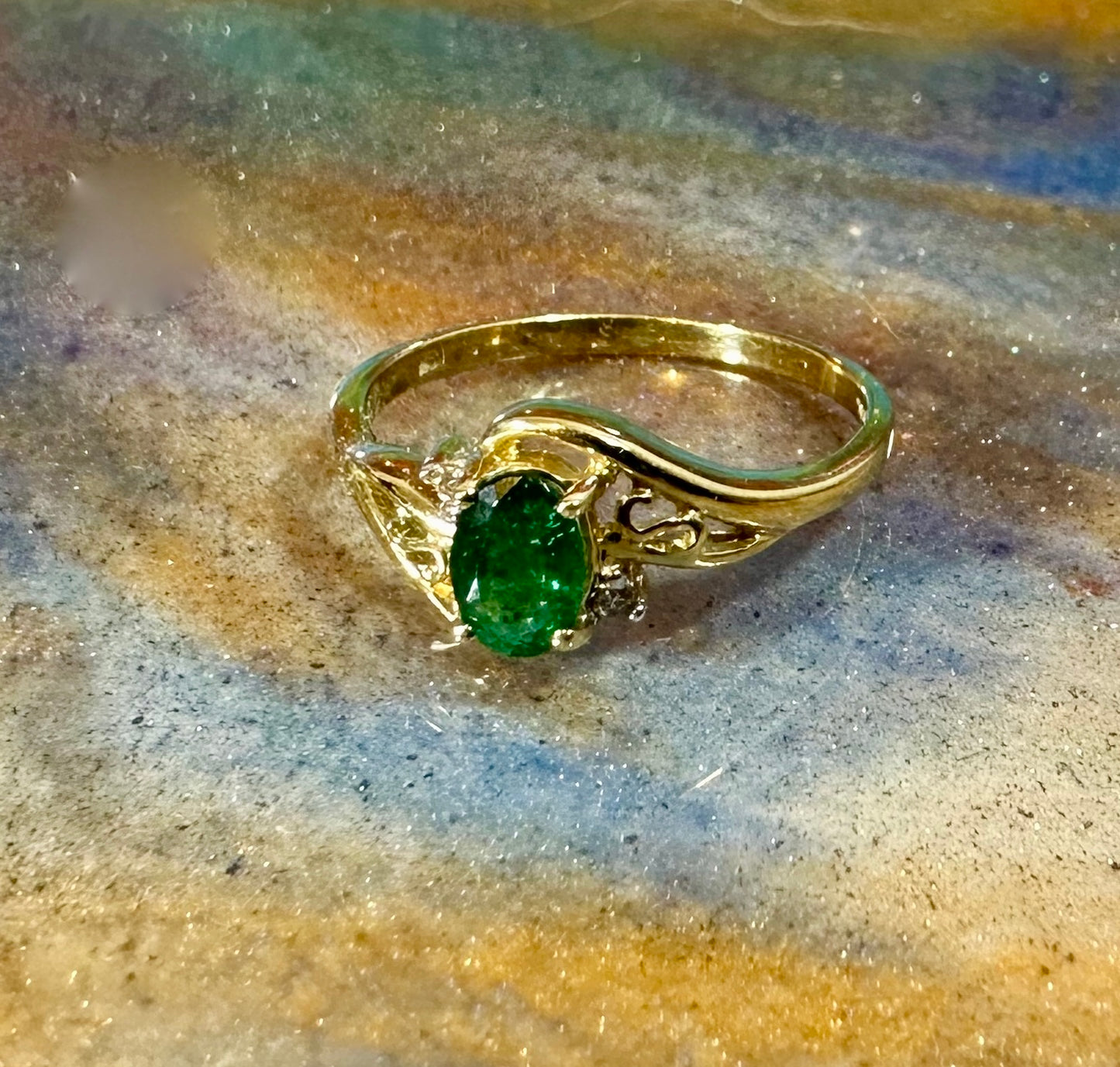 Emerald ring in 10K gold with small diamond accents