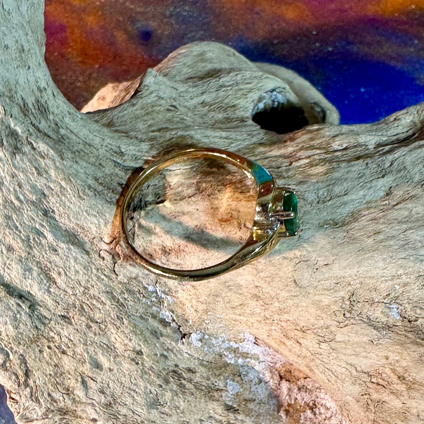 Emerald ring in 10K gold with small diamond accents