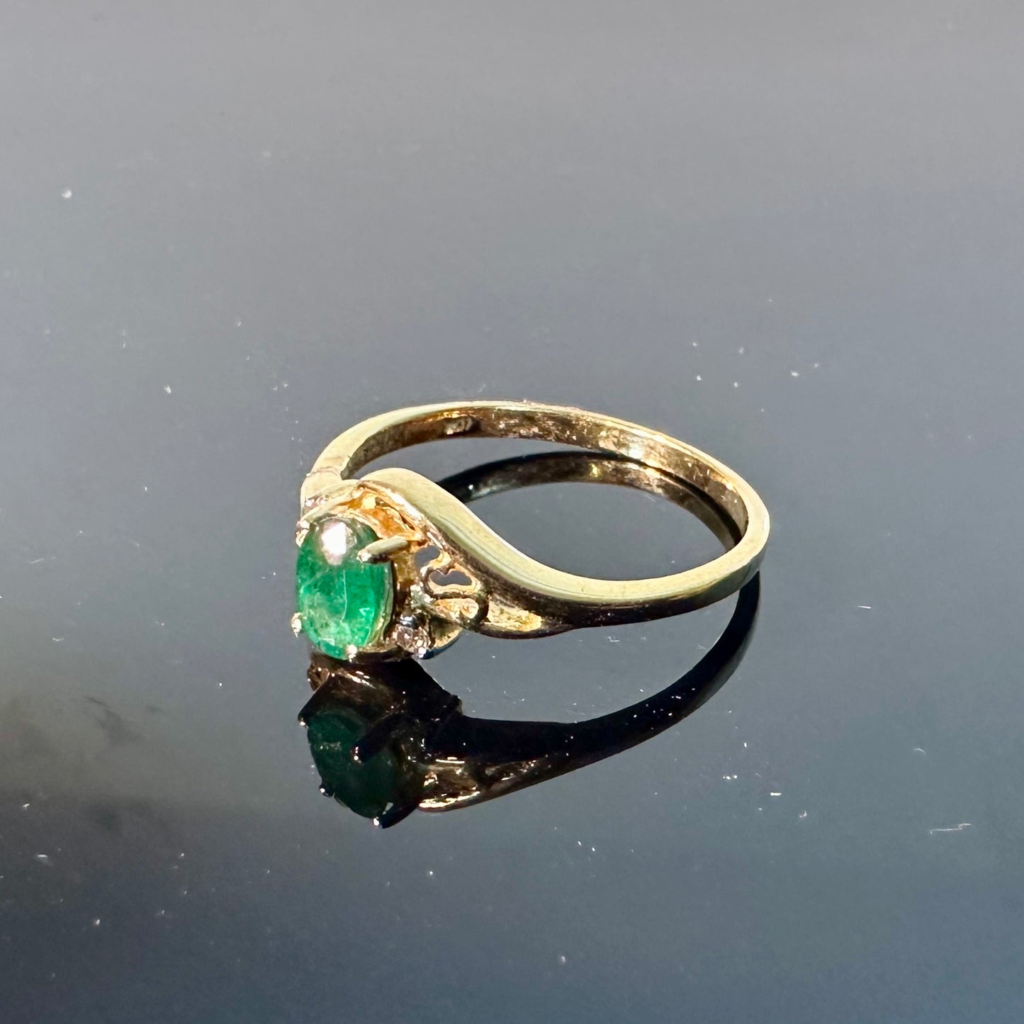 Emerald ring in 10K gold with small diamond accents