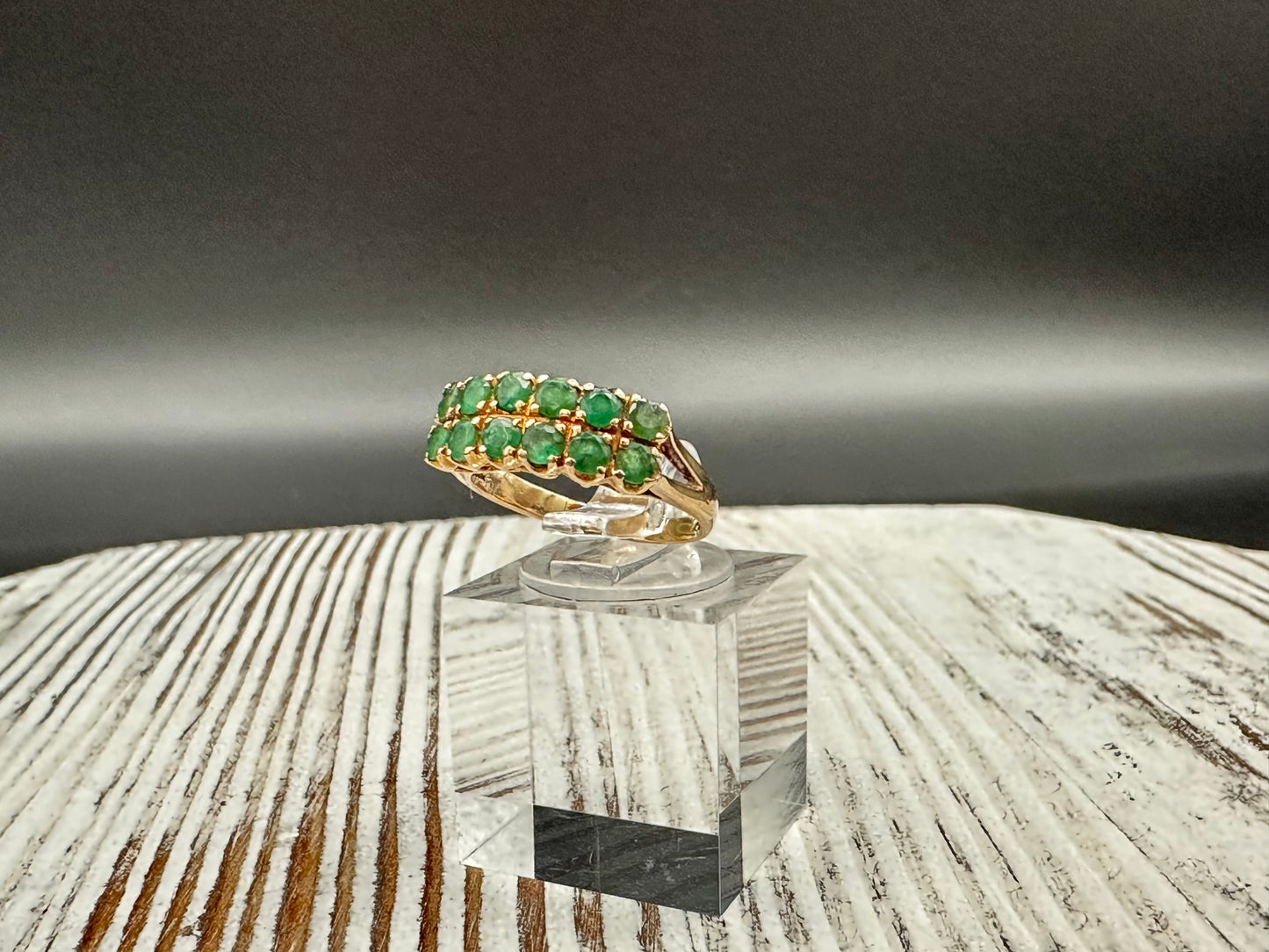 14K gold ring with 12 round cut Emeralds