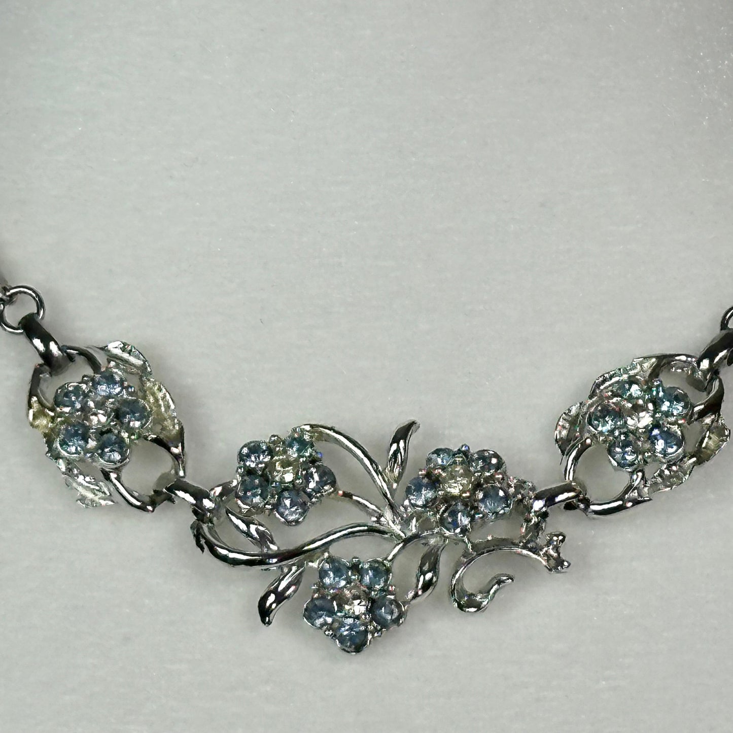 Aquamarine and White Crystal floral spray set in Rhodium Plating Necklace