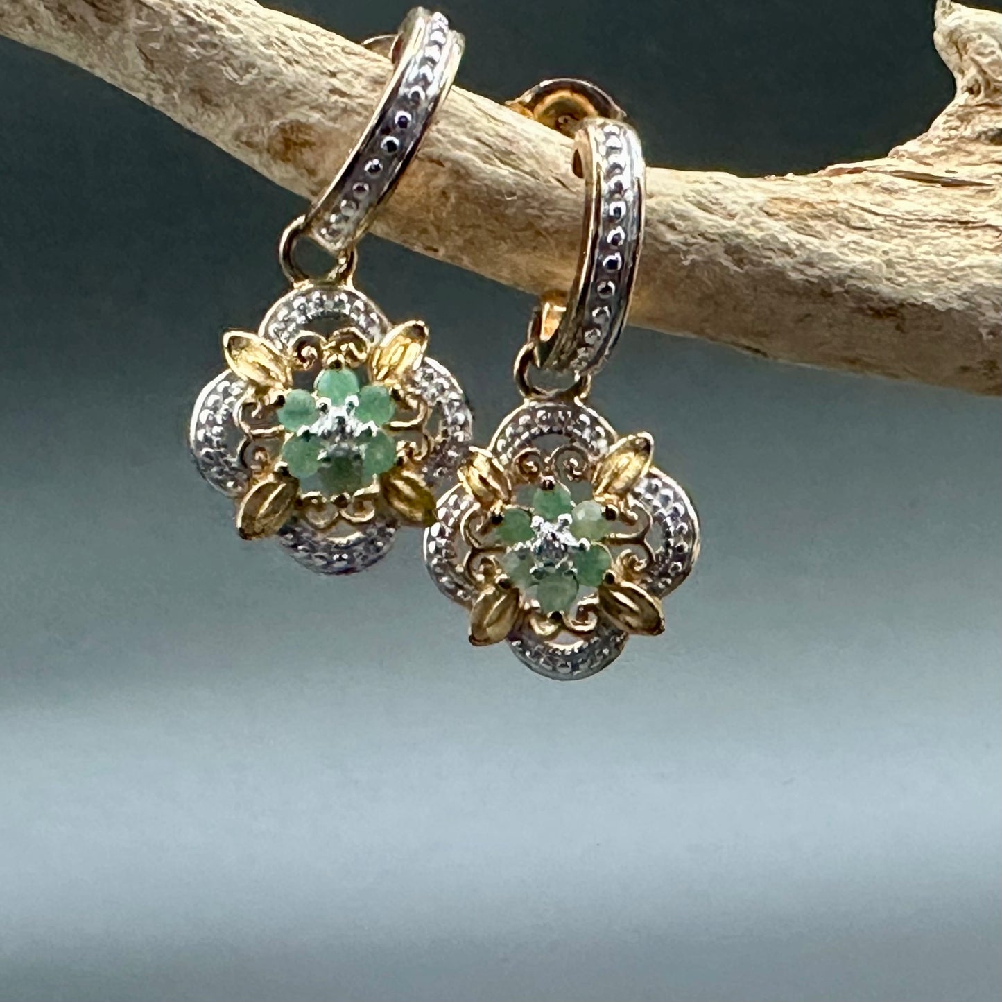 Emerald flower with diamond accent earrings in YG plated sterling silver