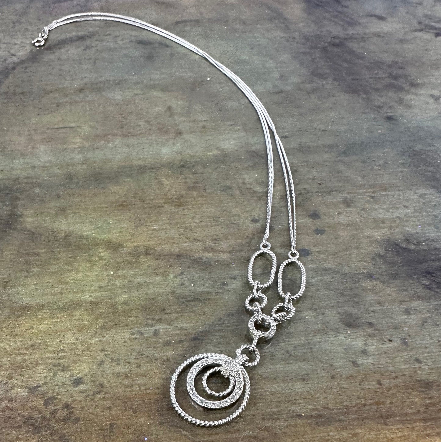 Filagree double chained necklace with diamond accents.
