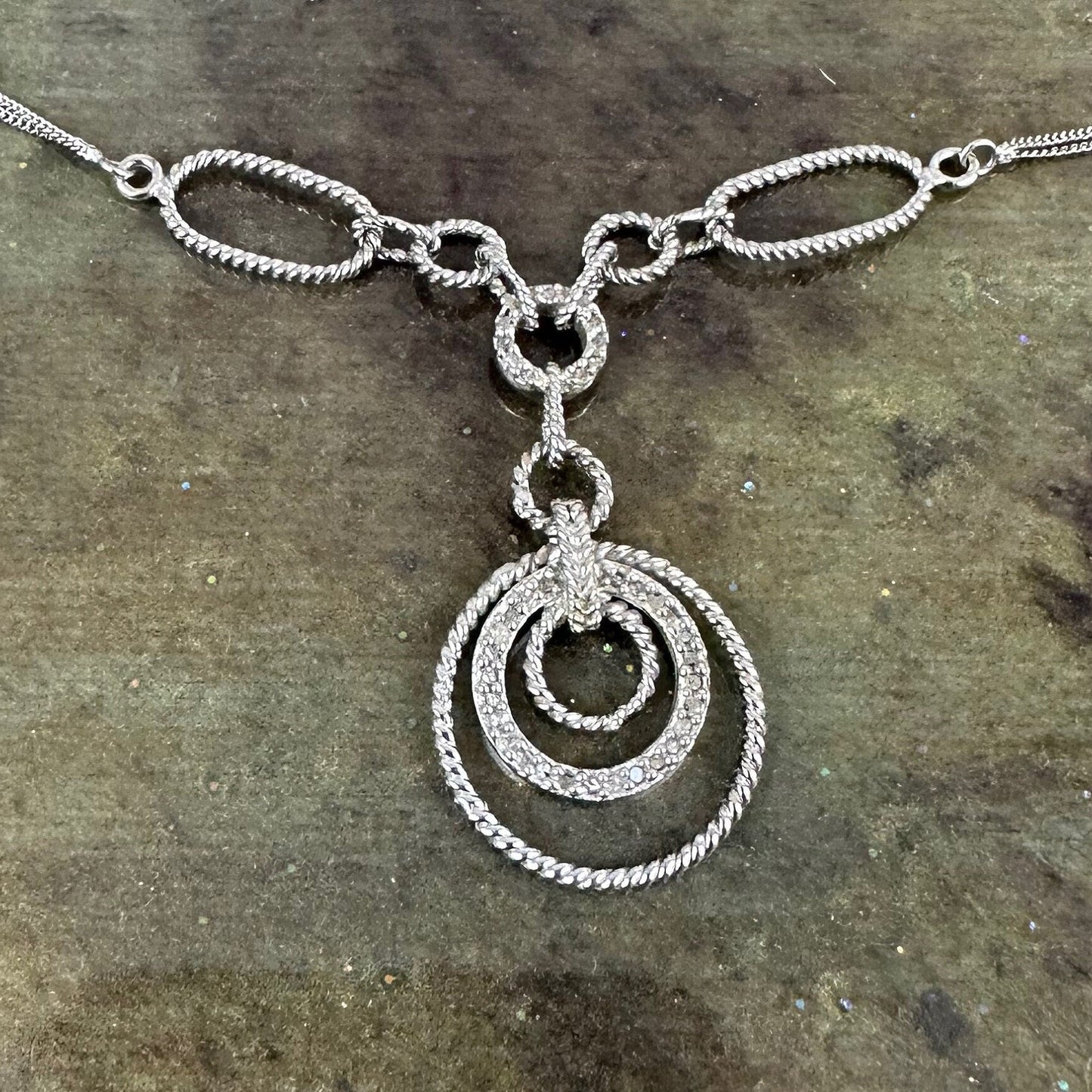 Filagree double chained necklace with diamond accents.