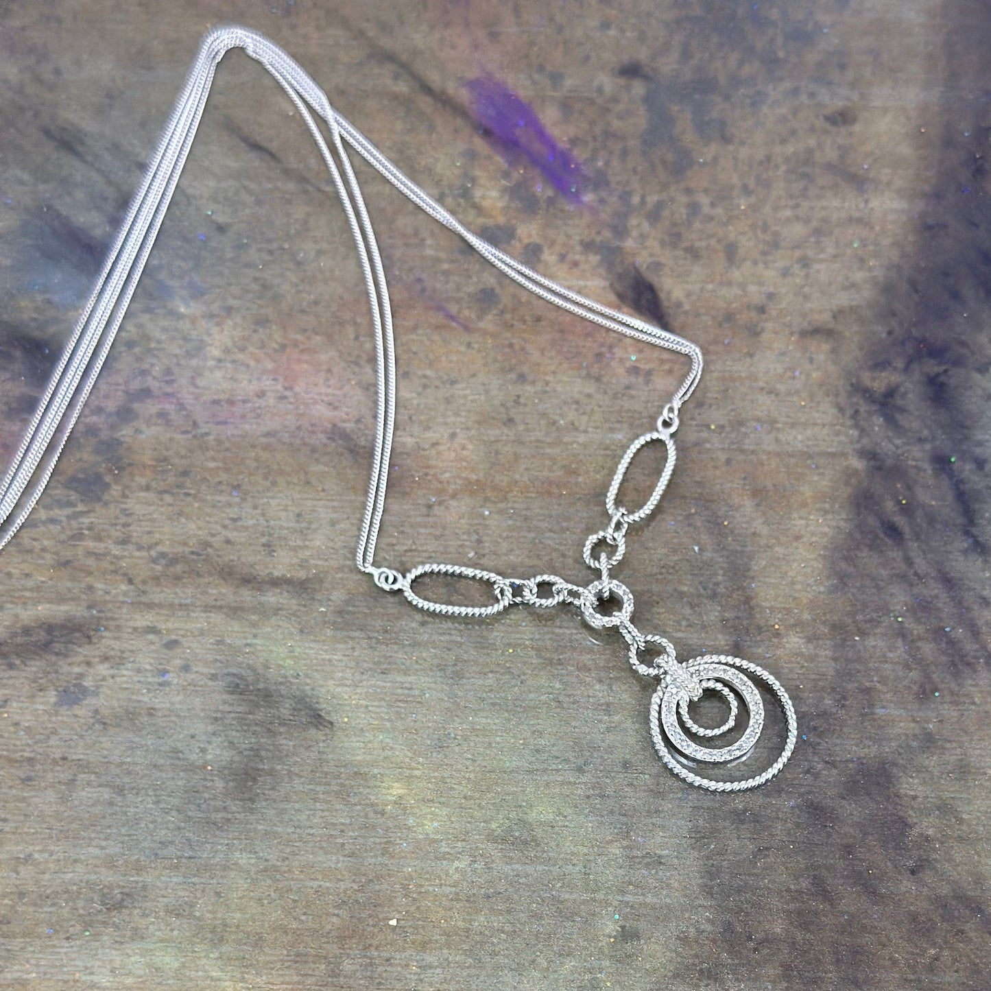 Filagree double chained necklace with diamond accents.