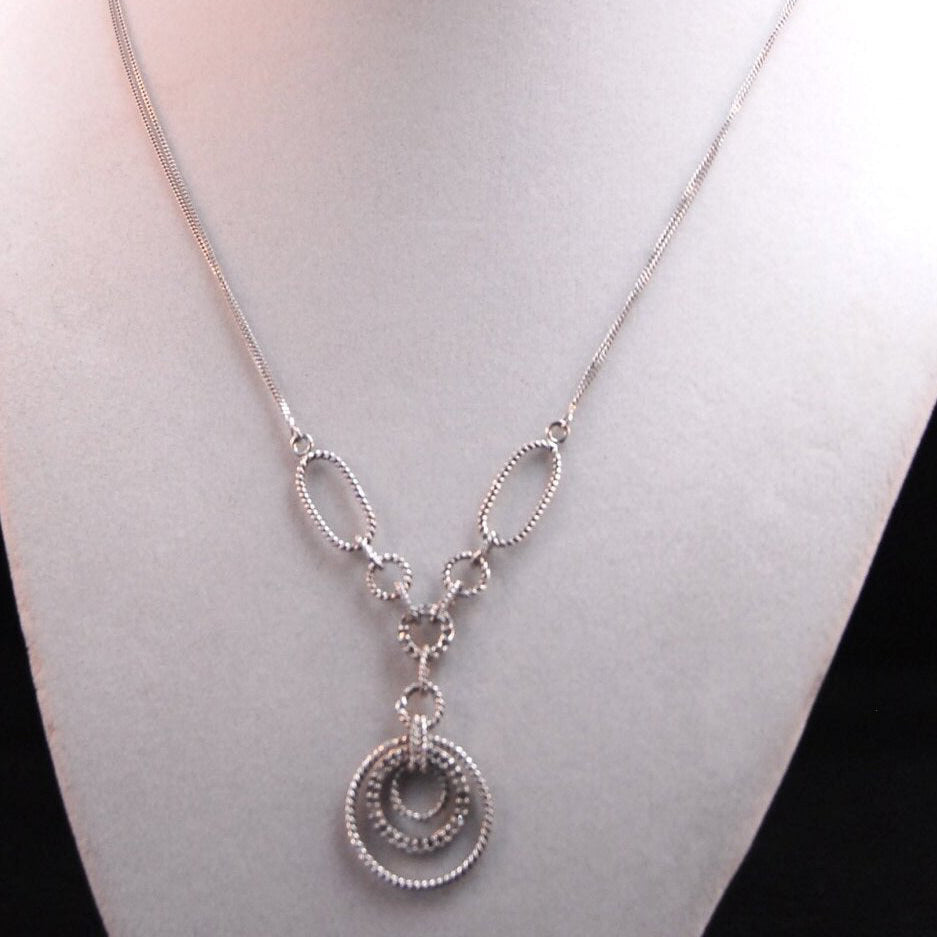 Filagree double chained necklace with diamond accents.