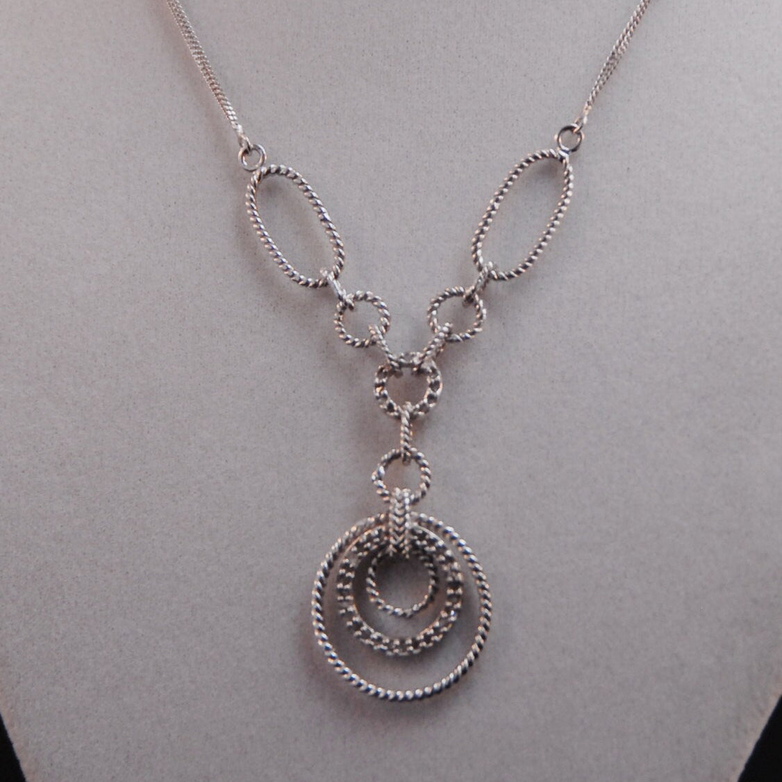 Filagree double chained necklace with diamond accents.