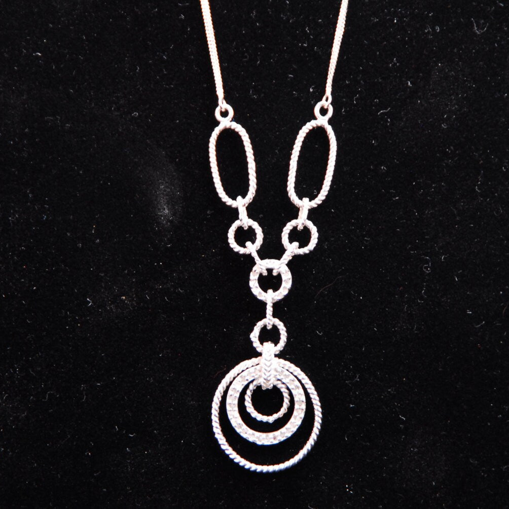 Filagree double chained necklace with diamond accents.