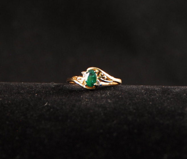 Emerald ring in 10K gold with small diamond accents