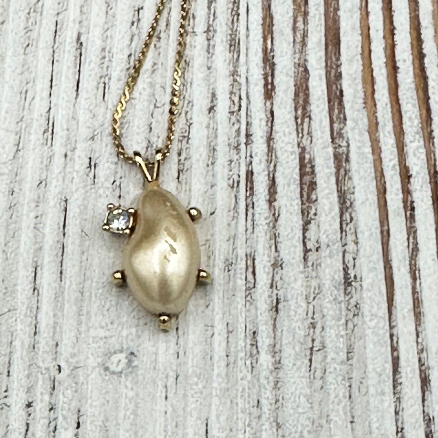 Faux pearl and Diamond pendant on Gold tone chain