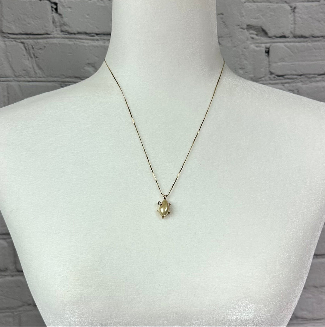 Faux pearl and Diamond pendant on Gold tone chain