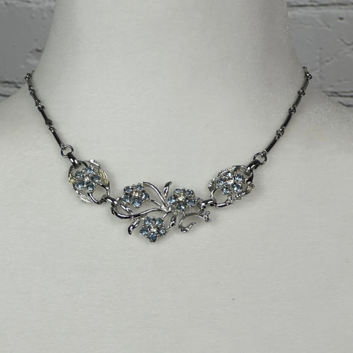 Aquamarine and White Crystal floral spray set in Rhodium Plating Necklace