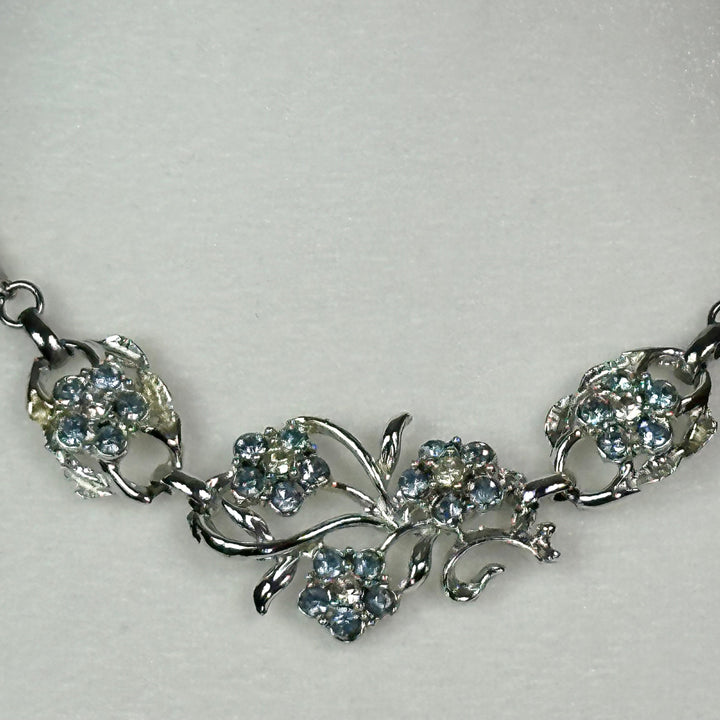 Aquamarine and White Crystal floral spray set in Rhodium Plating Necklace