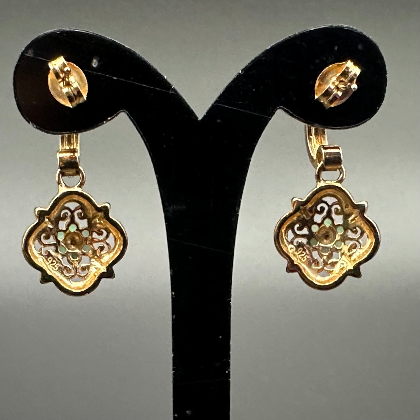 Emerald flower with diamond accent earrings in YG plated sterling silver