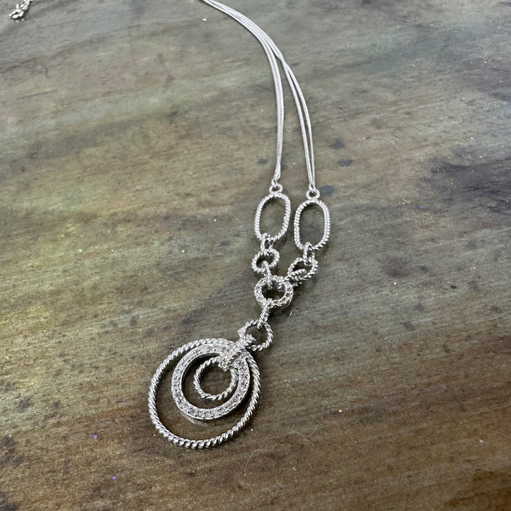 Filagree double chained necklace with diamond accents.