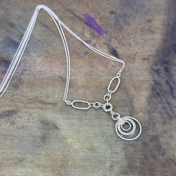 Filagree double chained necklace with diamond accents.