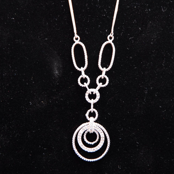 Filagree double chained necklace with diamond accents.